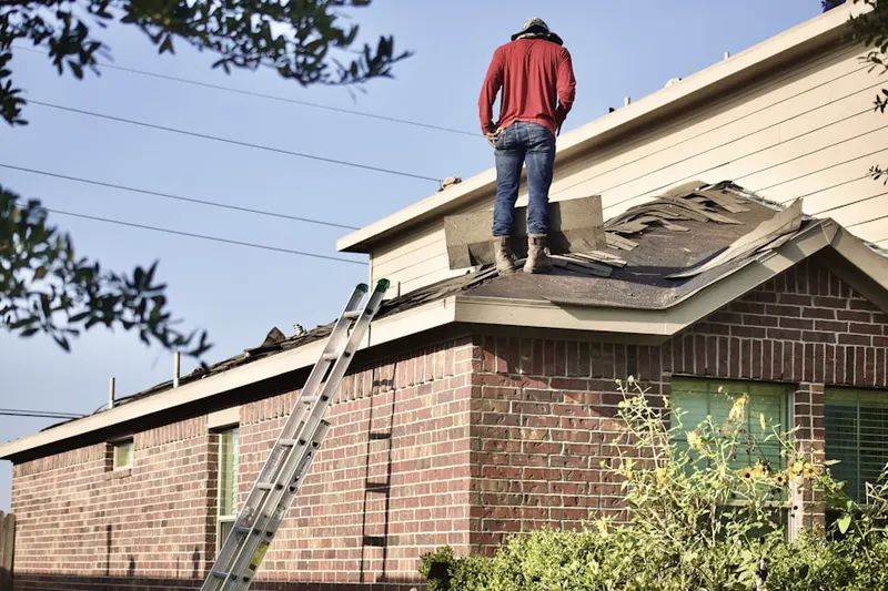 Professional roofer working on a residential roof in Brecksville